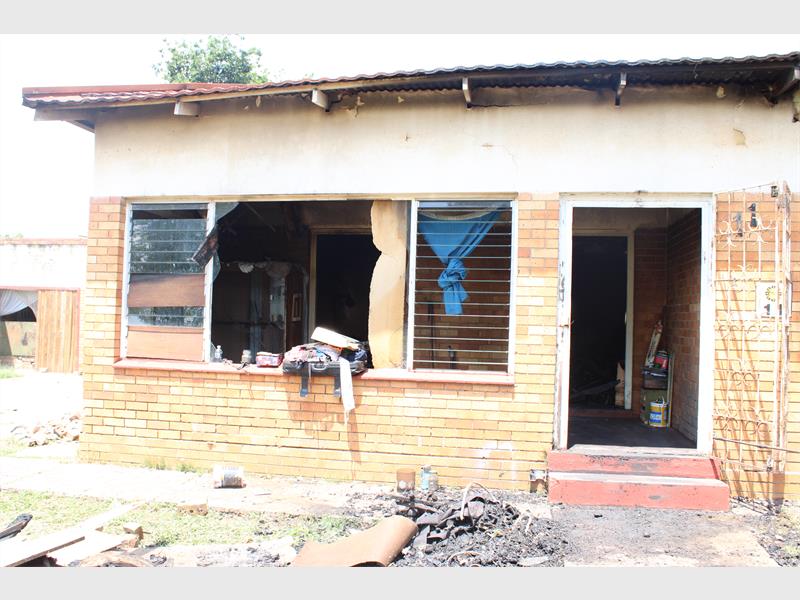 A Dunnottar family is pleading for assistance after a late-night candle fire destroyed their home, leaving eight people including a grandmother and child with nothing.