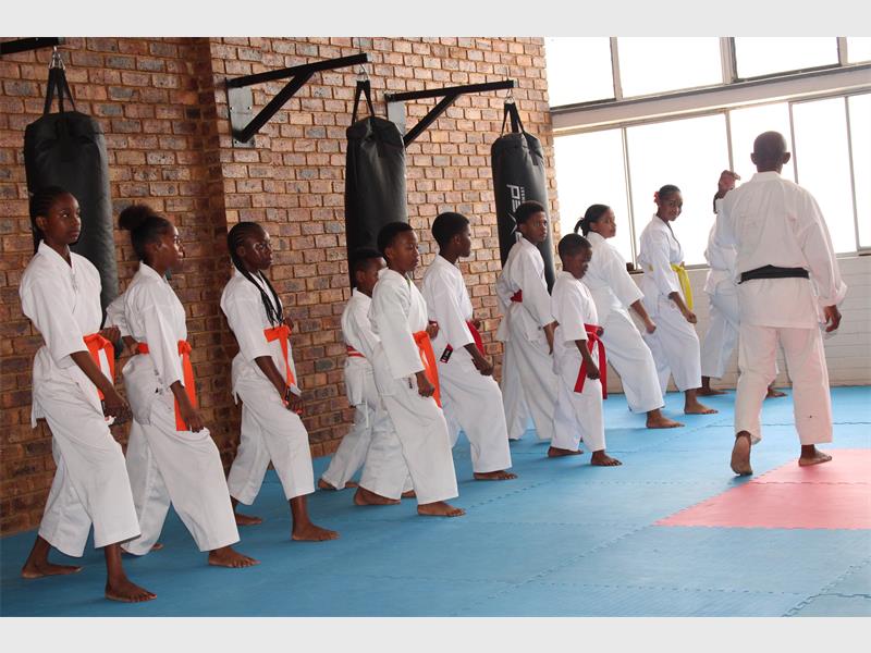 Parents and instructors witnessed impressive growth as young karate students advanced to new belt levels at the recent dojo grading.
