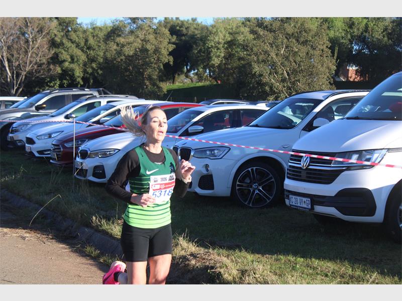 He clocked a personal best 49:00 to win his third consecutive men's 15km race.