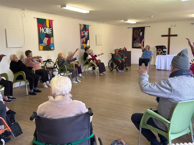 Residents including several over the age of 90 enjoyed a morning of stretching and fun during a Yoga Day on May 28.