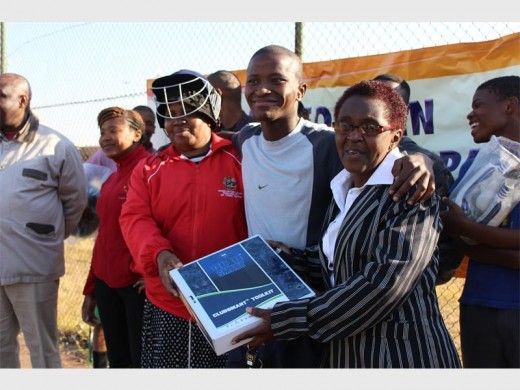 Ward Councillor for Mohalkeng, Dorah Mogale with Mohlakeng Cricket Club Chairperson, Tumi Mpaga and MMC for Social Development, Thembi Matuwane during the equipment handover.