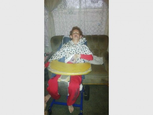 Nikita Hofman in her old make-shift wheelchair. Photo: Submitted. (WEB ONLY)