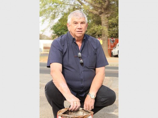 Councillor Ellik de Lange in the Greenhills Circle parking lot in front of Da Vinci's, pleased with one of his first successes since being elected.