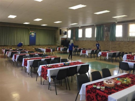 DA volunteers decorating tables before the big event. Photo submitted.