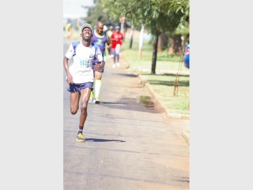 Frans Mola (South Deep) and silver Comrades Marathon medalist in front. Photo: Raymond Moeng