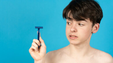 Teenager boy holding razor