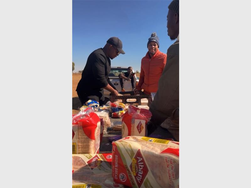 Residents, young and old, of Montrose Informal Settlement received a warm meal from the Modimo O Teng Foundation to ward off the cold.
