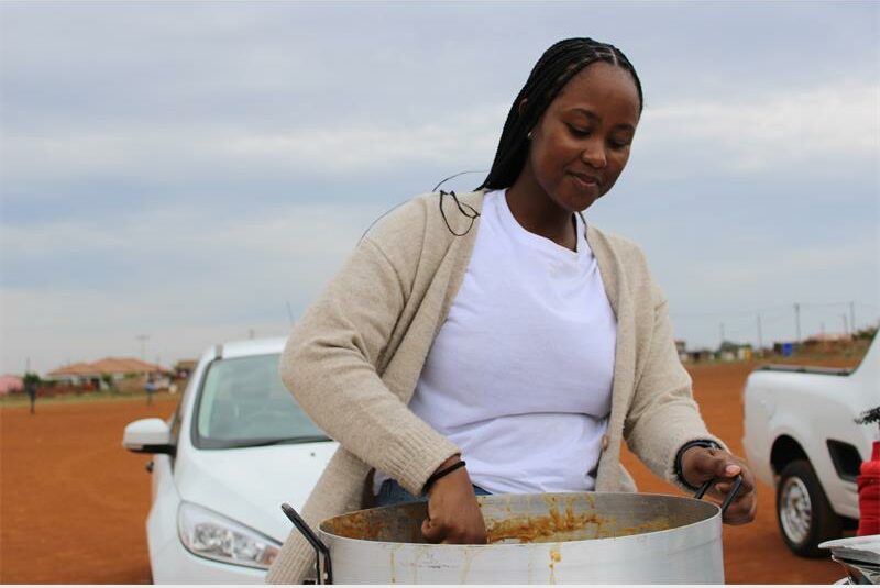 Seeing the hunger in her community, healthcare worker Rose Ngoasheng celebrated her birthday by serving hot meals to those in need.