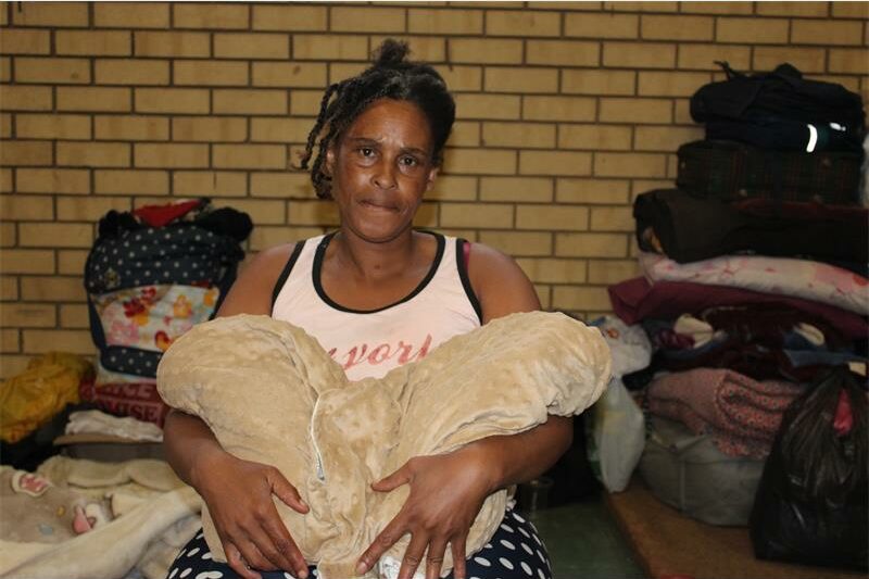 Violence linked to illegal miners has displaced Sporong residents, who are now sheltering at the Randgate Community Hall.