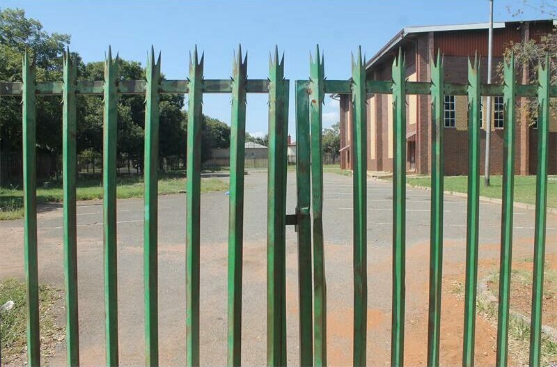 After fleeing Sporong due to escalating illegal mining violence, residents return home under police escort, as authorities promise improved security and housing solutions.