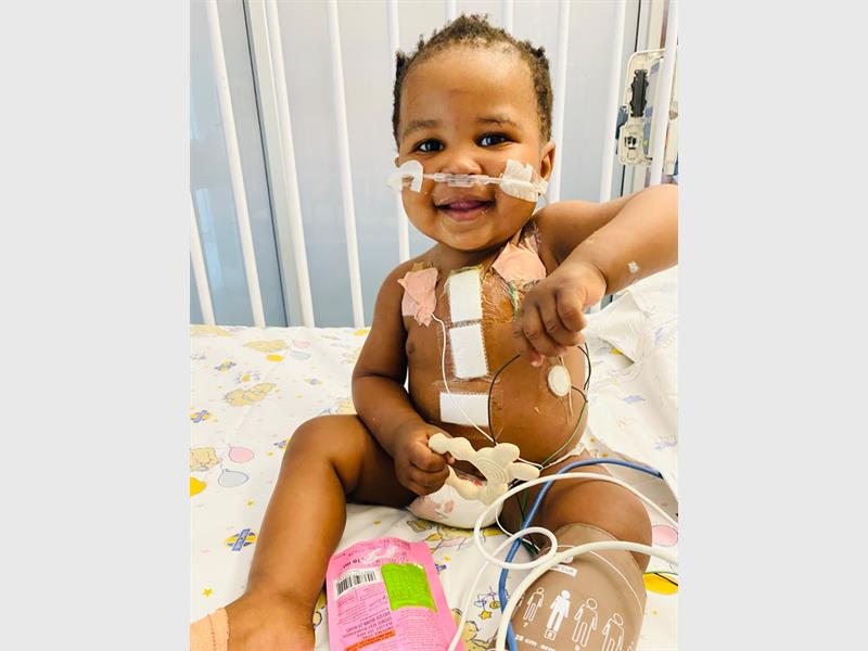 After undergoing open-heart surgery earlier this year, the one-year-old now faces another critical procedure, but their medical aid funds are depleted.