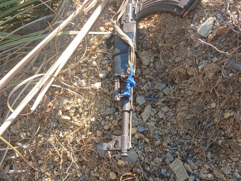 Police say the suspect was found with a fully loaded magazine during an illegal mining operation.