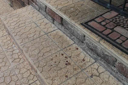 THE scene has been cleaned but blood stains remain at the scene of the shooting.