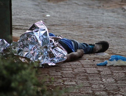 The body of the victim lies partially covered in the CBD.