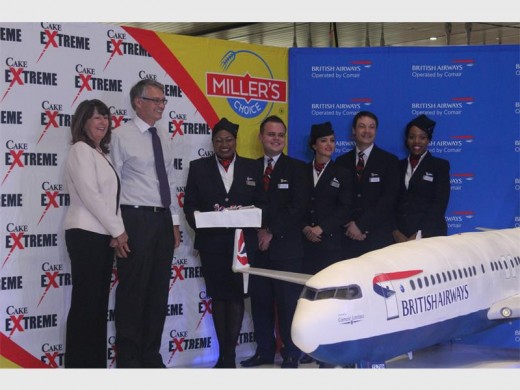SUE Petrie, British Airways commercial manager and Comair CEO, Erik Venter, with some of the staff from British Airways at the cake