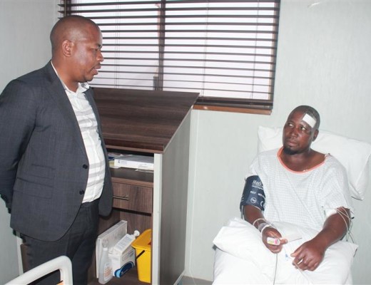 EKURHULENI mayor, Clr Mzwandile Masina, talks to accident survivor, Thembikile James.