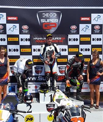 CJ Hackart on the podium after winning the first race at Red Star Raceway.