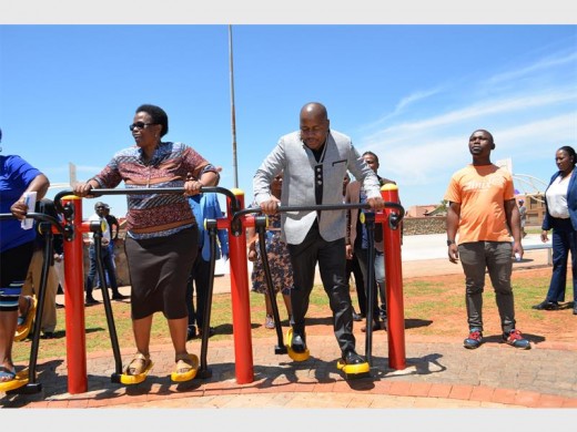 MMC for waste and environmental resource management services, Clr Ndosi Shongwe, and Ekurhuleni executive mayor, Mzwandile Masina, test the gym equipment of the new park - at the official opening of Ukusuka Public Park in Vosloorus ext 14.