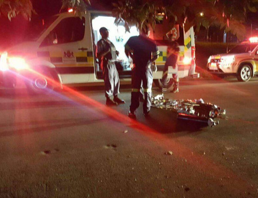 The victim's body lies covered in the road. Photograph: Intelligence Bureau SA