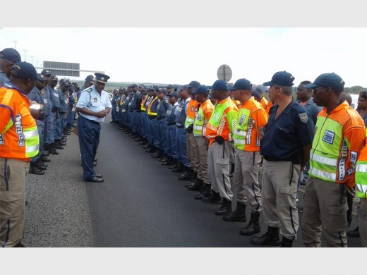 POLICE and metro officers are addressed before the start of the roadblock operation. Photograph: Kempton SAPS