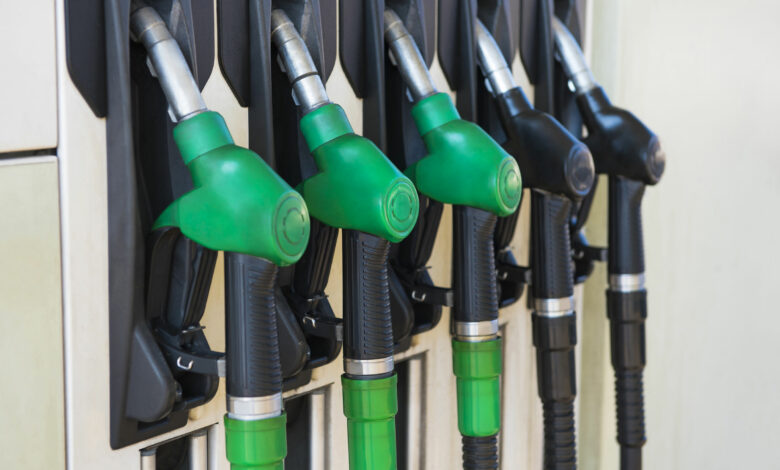 Different gas diesel pistols, at gas station.