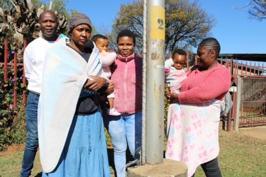 Rhodesfield residents next to a stolen cable.