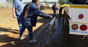 One of the City’s personnel collecting water samples from water tankers before they are dispatched.