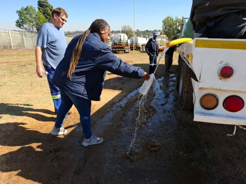 One of the City’s personnel collecting water samples from water tankers before they are dispatched.