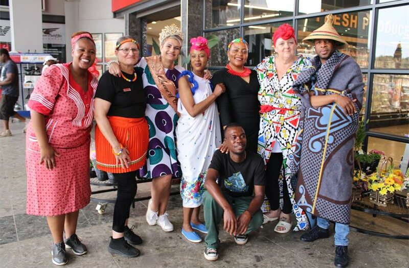 Customers and staff celebrate Heritage Day in their respective attires.