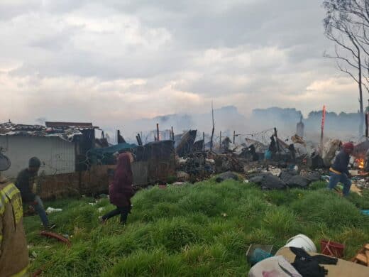 Residents scrambled to save their belongings as flames rapidly spread between shacks.