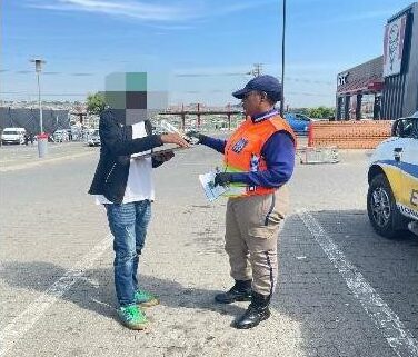 EMPD officers educate shoppers and drivers on road safety and crime prevention at Birch Acres Mall.