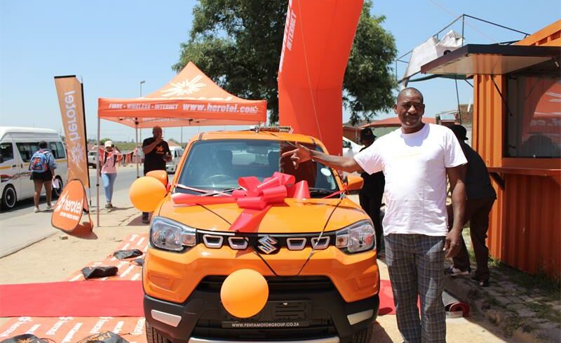 Jerry Tlhoele from Moedi Section won a Suzuki S-Presso in Herotel’s Vuka Summer Competition, marking a festive celebration for the community.