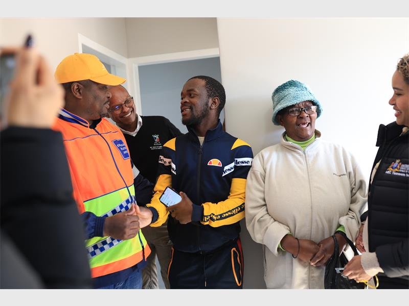 Beneficiaries were urged to safeguard their new homes as government officials handed over 140 housing units in Clayville.