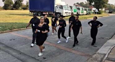 Women participating in GBV awareness walk hosted by Khuluma Freight Services.