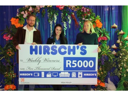 The Germiston City News team, Louise (30) and Hennie (36) Bingle with Brigitte Thysse, Hirsch’s PRO at the launch of the Reynold’s Race.Here they see what it will feel like to win the weekly voucher from Hirsch's for R5 000.