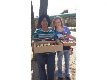 Avril Elizabeth Home supervisor Ncedisa Mtimkhulu (left), and Sheridene du Plessis (16), with the cupcakes she donated to the residents of the Avril Elizabeth Home, recently