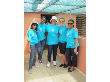 The RMB Private Bank "Painting" team admire their kennel painting job, which was so well done.