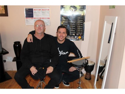 Larry Rose (left) and Marcio De Brito are ready and able to impart their knowledge to young drummers.