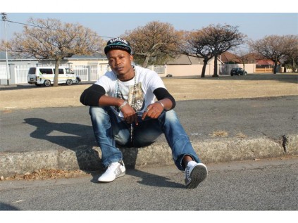 In pensive mood, Legacy (Anslem Eze) thinks about the hip hop music scene.