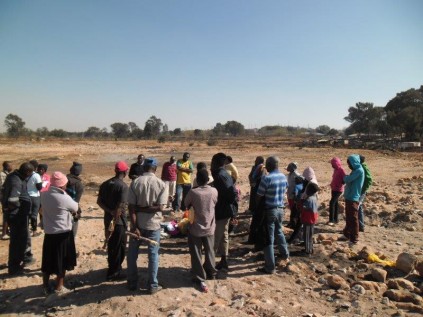 The elders (facing the camera) chat to the community of Makause. From left are: Mqhele Mlotshwa, Khumbulani Khumalo and Sihlobosenkosi Mpofu.