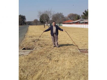 DA Ward 39 councillor Michael Kriek stands between the storm water manholes with missing covers, at the corner of Dewlish Avenue and Brenda Road, in Dinwiddie.