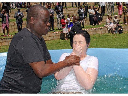Angelique van Rensburg (21) was one of 305 people baptised at the Jehovah's Witness Regional Convention, last weekend. She was baptised by Arthur Booi.