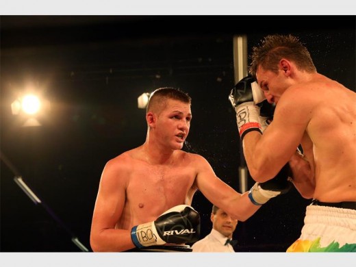 There was explosive action in the fight for the vacant IBO Light Heavyweight World Title, between Tommy Oosthuizen (left) and Ryno Liebenberg, at Emperors Palace, on Saturday. Photo by: Debbie Yazbek.