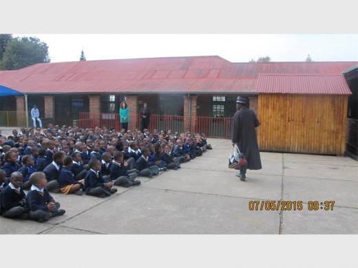Members of the Primrose Crime Prevention Youth Desk perform a play for the children.