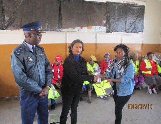 Germiston SAPS hand out reflector vests to patrollers.