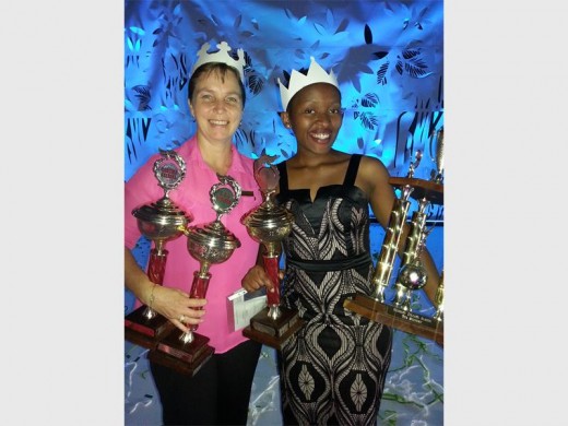 Director of Germiston Child Welfare Barbara Bouwer (left) helps Janet Gapare celebrate being named the 2015 Dux Student at Reunet College.