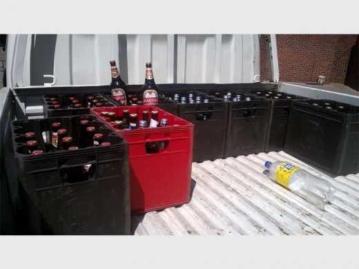 Bottles of beer were seized during the arrest of five illegal-tavern owners.