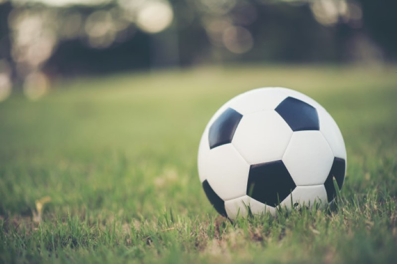 football-on-grass-field-in-the-park_1150-3945-Custom
