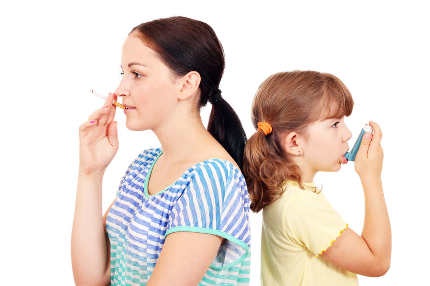 girl smoking cigarette and little girl use inhaler