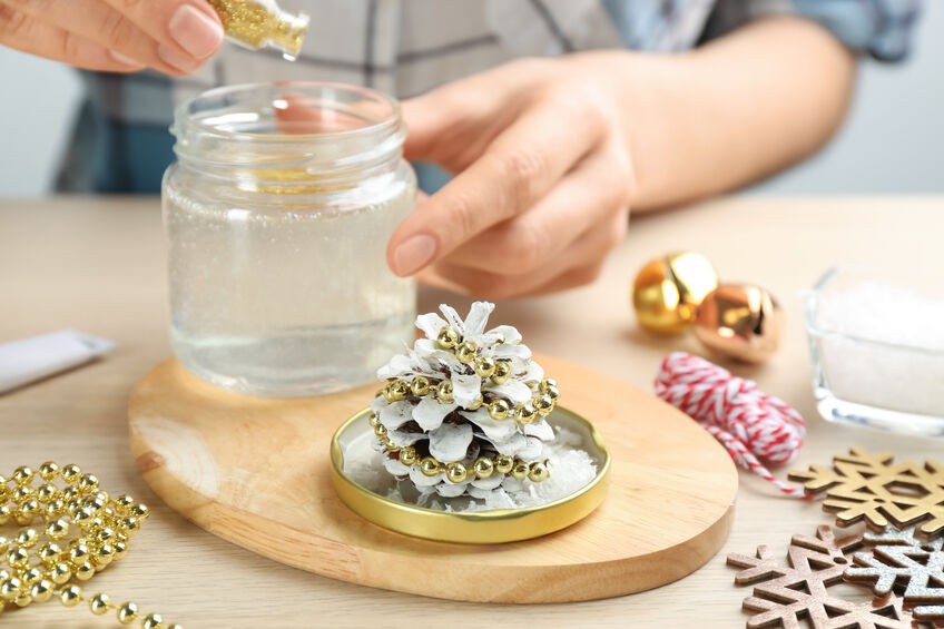 Have fun with your child making a pinecone snow globe
